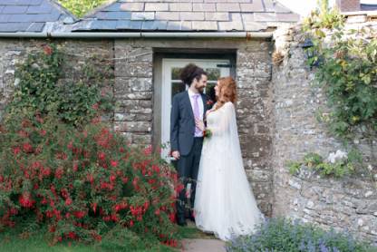 Couple%20getting%20married%20and%20the%20couple%20have%20their%20couples%20photos%20done%20infront%20of%20stone%20building
